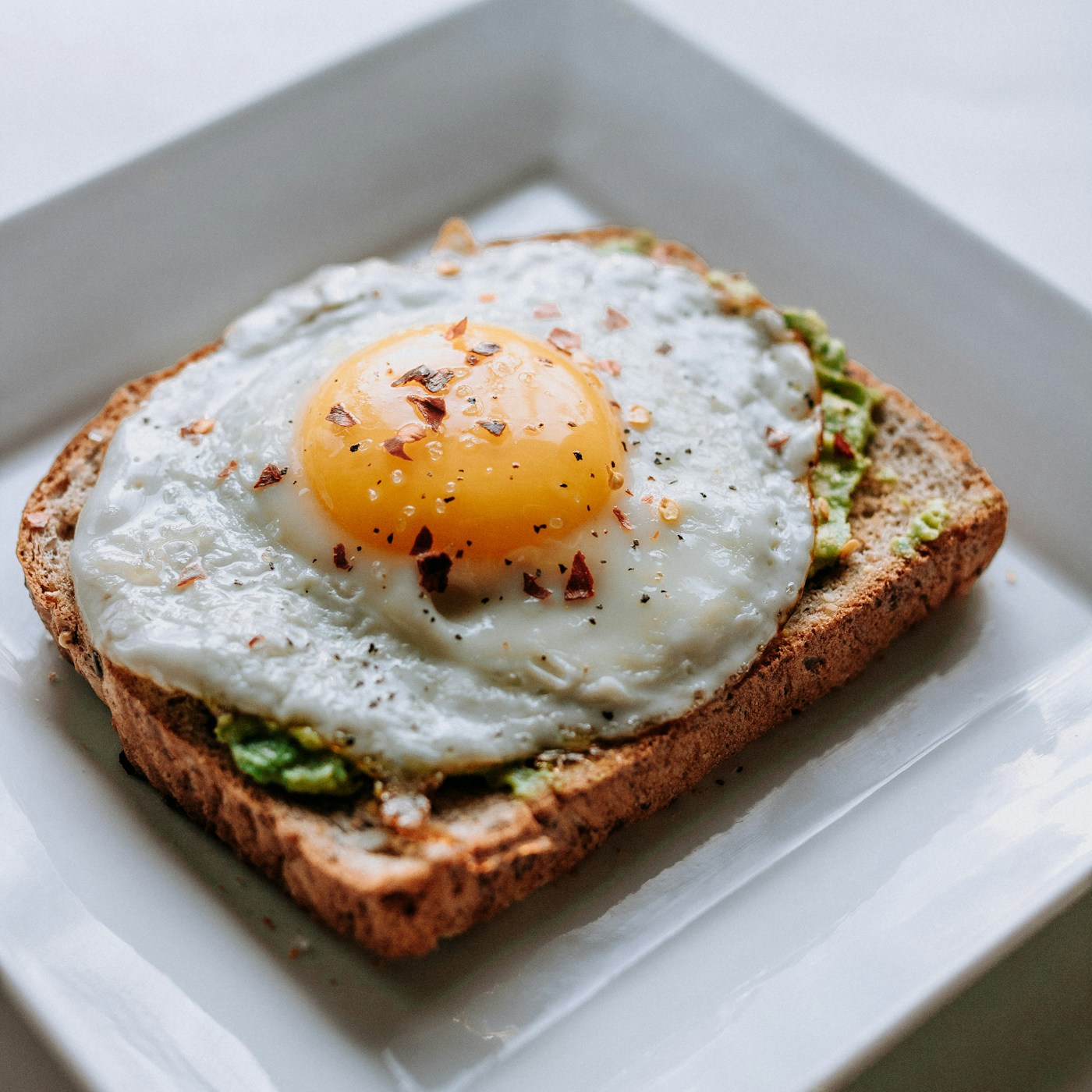 Kaya toast on a plate with kopi